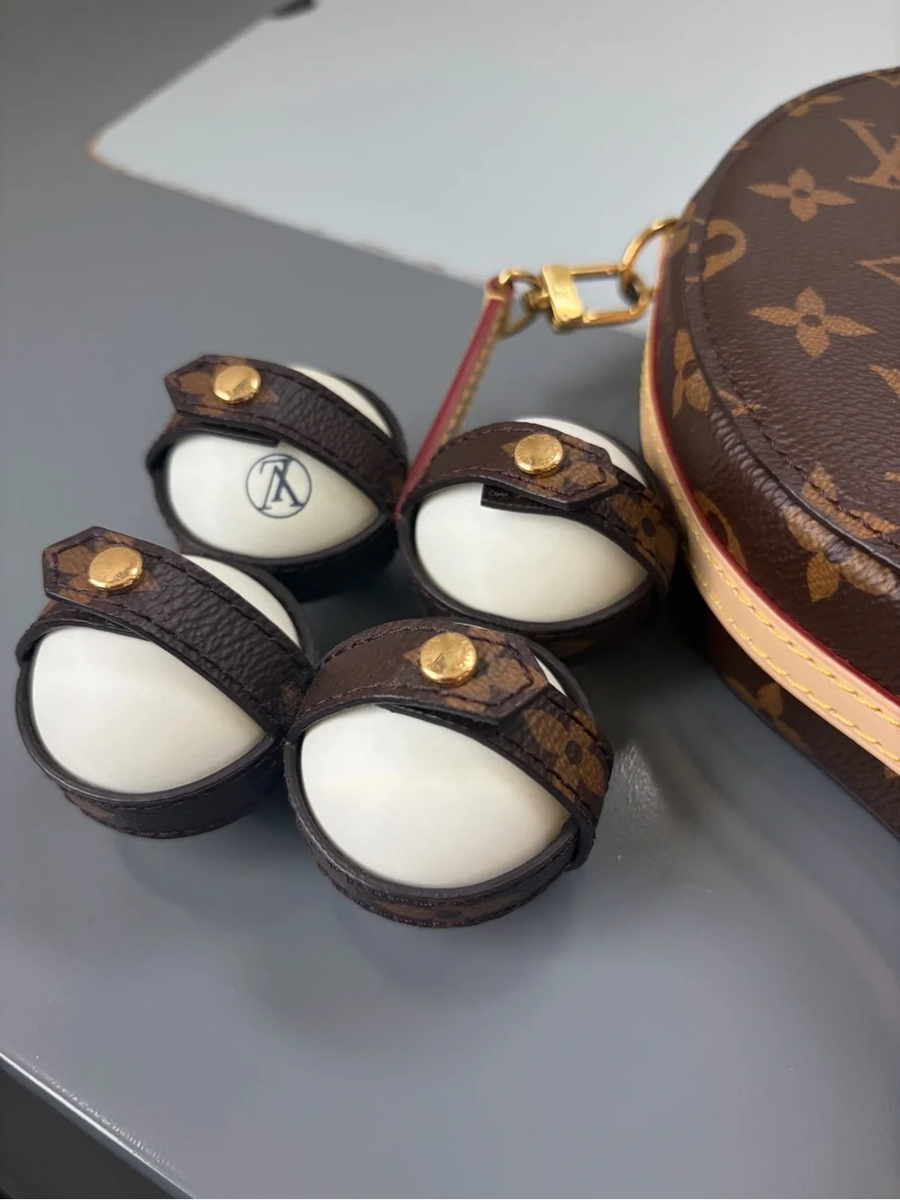 Louis Vuitton Brown Monogram Paddles and Case with Matching Balls